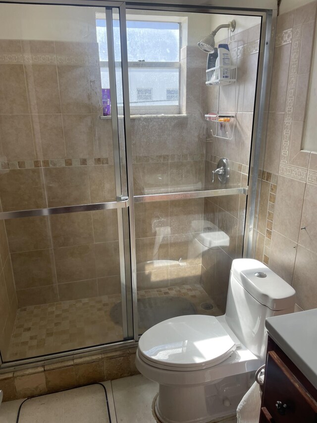 714 NE 10th St Unit 205, Hallandale Beach, FL 33009 - full bathroom with tile walls, toilet, a shower stall, and vanity
