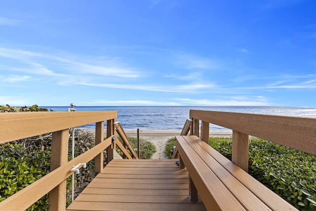 view of property's community with a view of the beach and a water view