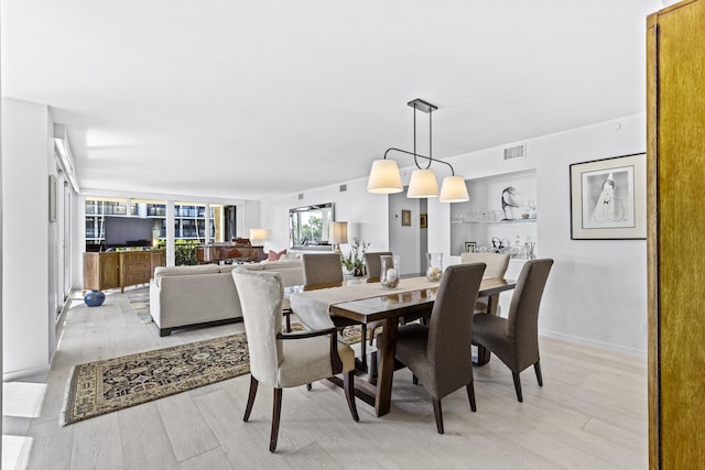 dining room with light hardwood / wood-style flooring