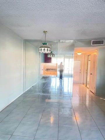 interior space featuring a textured ceiling