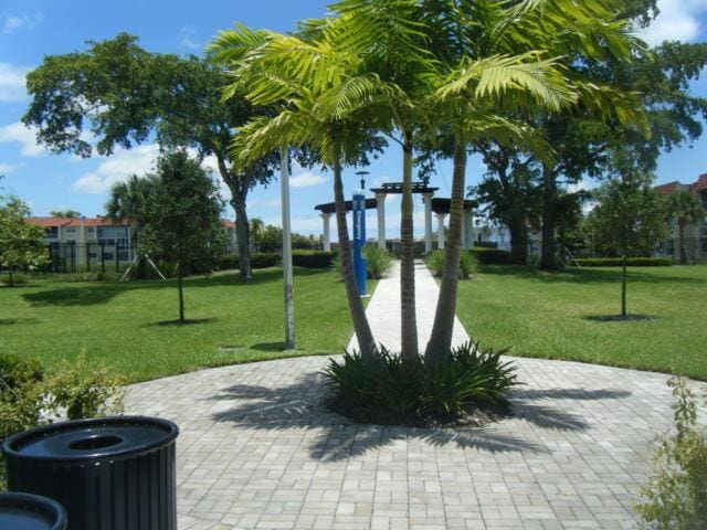 view of home's community featuring a lawn