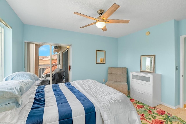 tiled bedroom featuring access to exterior, a textured ceiling, multiple windows, and ceiling fan