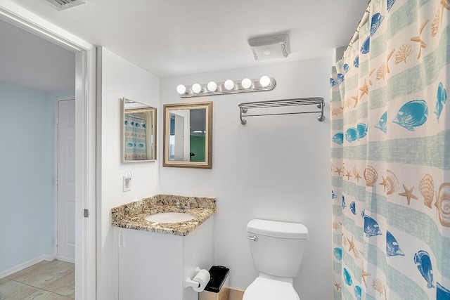 bathroom featuring walk in shower, vanity, and toilet