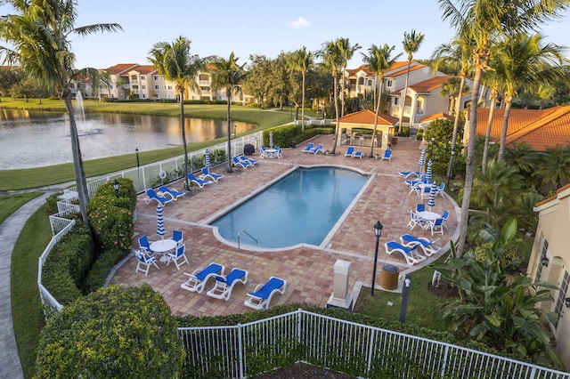 view of pool featuring a gazebo, a patio area, and a water view