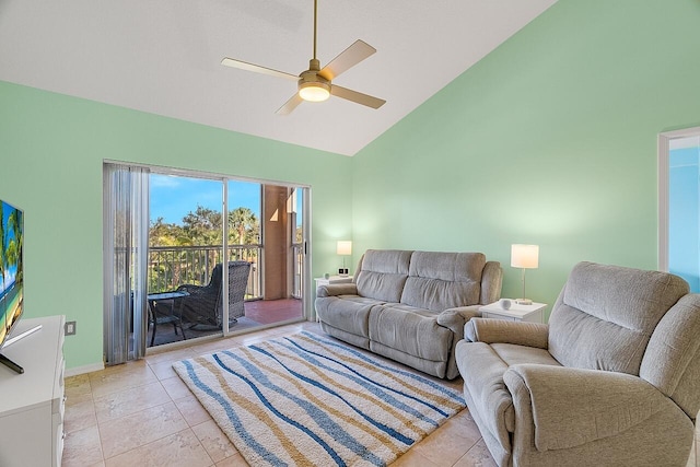 tiled living room featuring ceiling fan and high vaulted ceiling