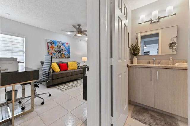5650 Parkwalk Cir E, Boynton Beach, FL 33472 - interior space with light tile patterned floors, a sink, a textured ceiling, and ceiling fan