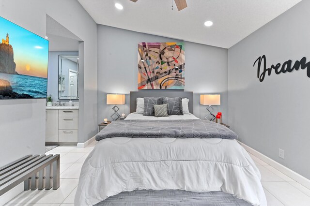 tiled bedroom with ceiling fan and ensuite bathroom