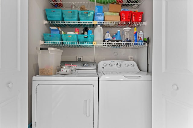 5650 Parkwalk Cir E, Boynton Beach, FL 33472 - clothes washing area with washing machine and dryer and laundry area