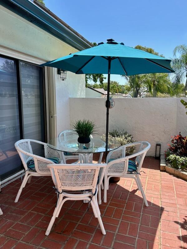 5650 Parkwalk Cir E, Boynton Beach, FL 33472 - view of patio / terrace with outdoor dining space