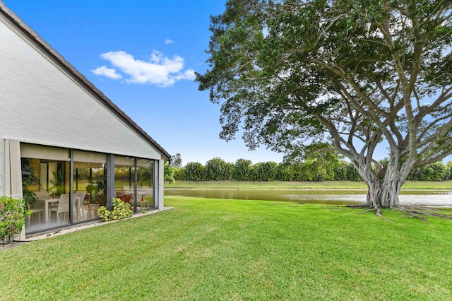 5650 Parkwalk Cir E, Boynton Beach, FL 33472 - view of yard with a sunroom and a water view