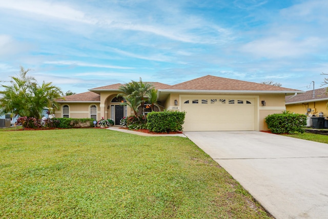 single story home featuring a front lawn and a garage