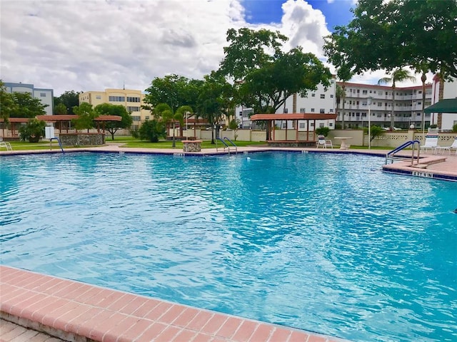 view of swimming pool with a patio