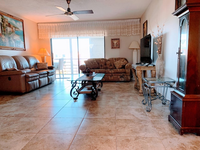 tiled living room featuring ceiling fan