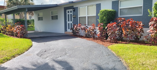 exterior space with a carport