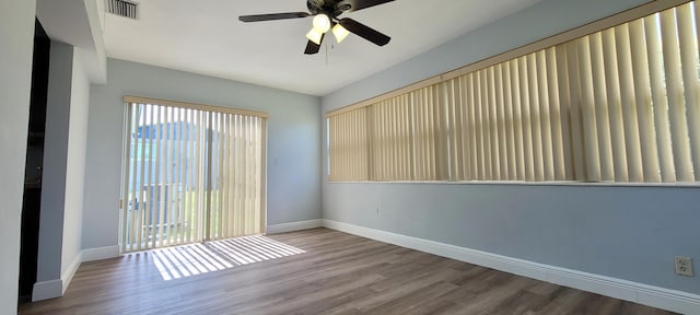 unfurnished room featuring hardwood / wood-style floors and ceiling fan