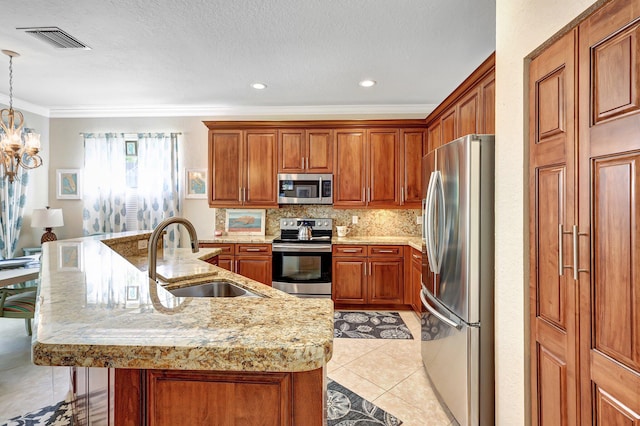 kitchen featuring visible vents, backsplash, light tile patterned floors, stainless steel appliances, and a sink