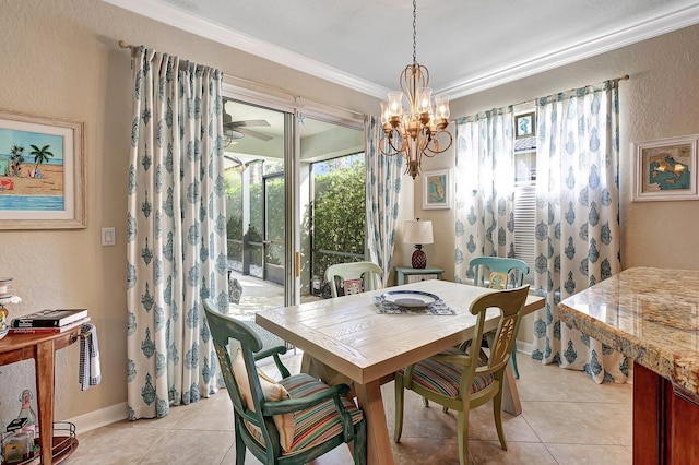 dining area featuring a notable chandelier, light tile patterned floors, a textured wall, and ornamental molding