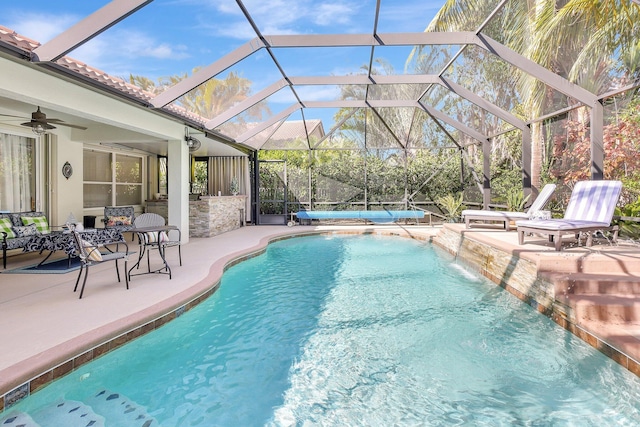 pool featuring a patio area and a ceiling fan