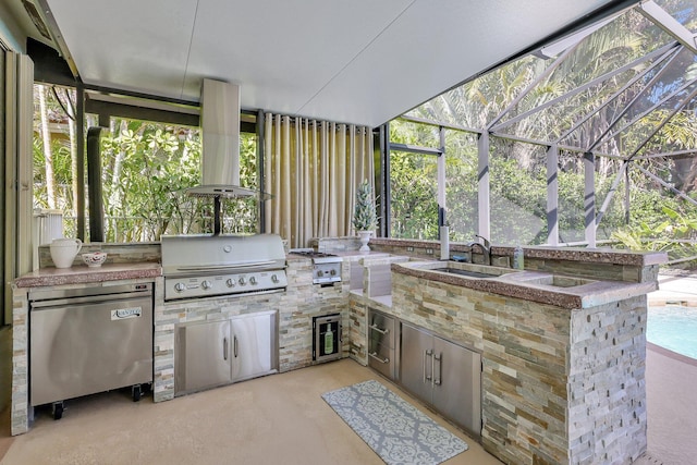 view of patio with a lanai, grilling area, an outdoor kitchen, and a sink