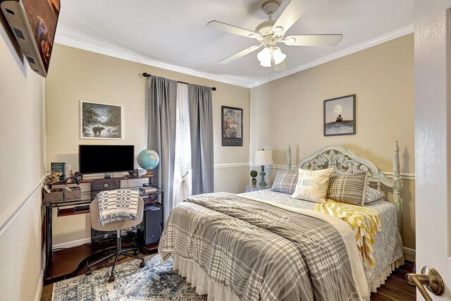 bedroom featuring crown molding, ceiling fan, and wood finished floors