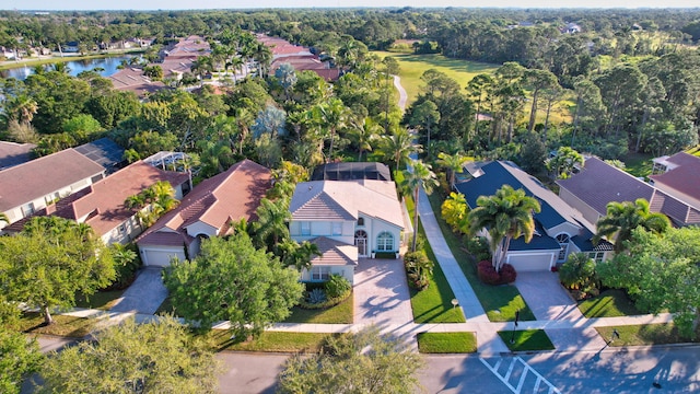 drone / aerial view with a residential view and a water view