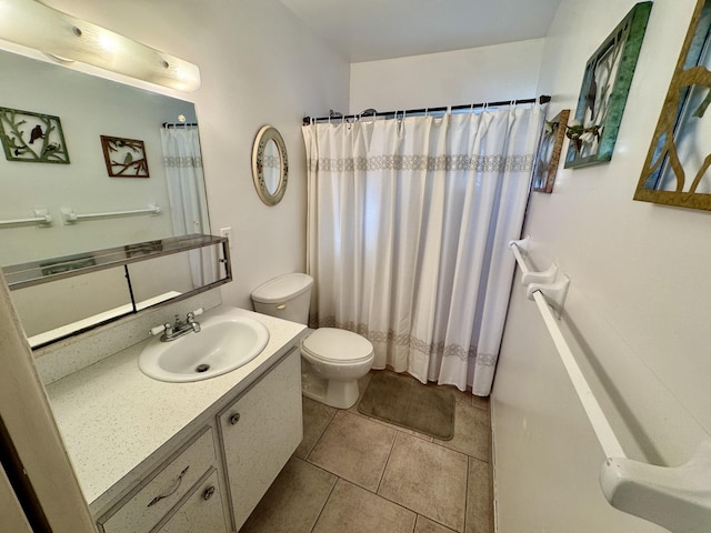 bathroom with toilet, a shower with curtain, tile patterned flooring, and vanity