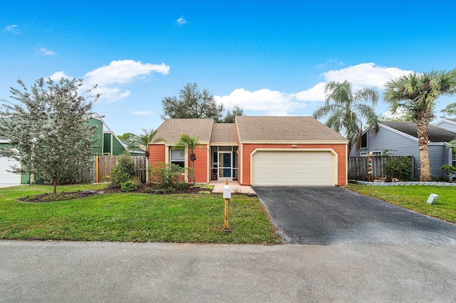 view of front of home with a garage and a front lawn