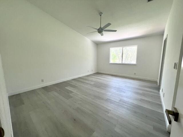 unfurnished room with ceiling fan and light wood-type flooring