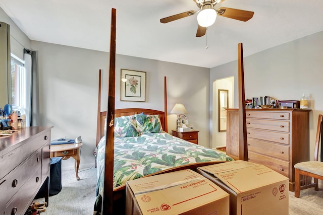 bedroom with ceiling fan and light colored carpet