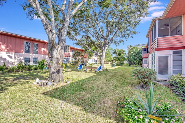 view of yard with a sunroom