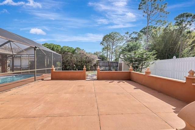 view of patio / terrace with a lanai