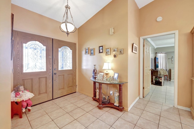 tiled foyer entrance with vaulted ceiling