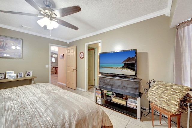 bedroom featuring light tile patterned floors, ornamental molding, a textured ceiling, and ceiling fan