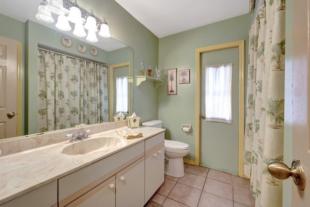 bathroom with vanity, tile patterned floors, and toilet