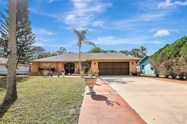 ranch-style home featuring a garage and a front yard