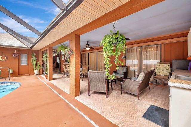 view of patio featuring area for grilling and ceiling fan