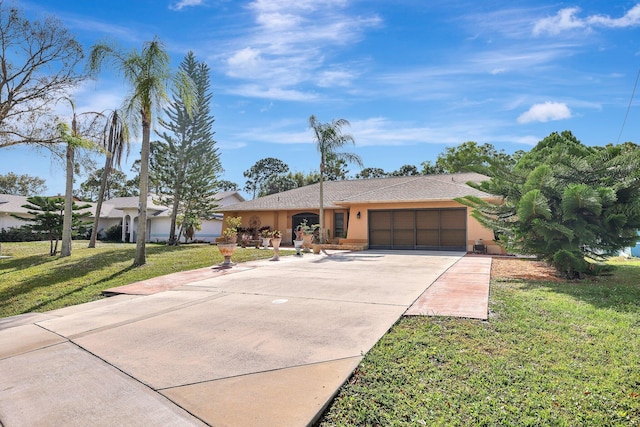 single story home with a garage and a front yard