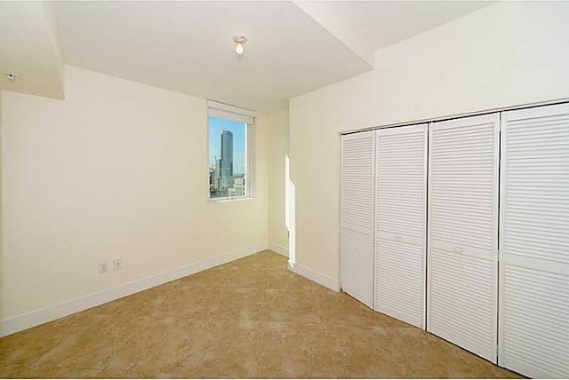 unfurnished bedroom featuring a closet