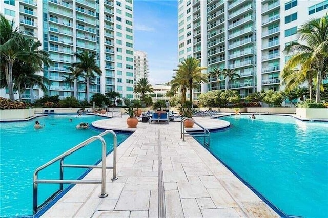 view of swimming pool with a patio area