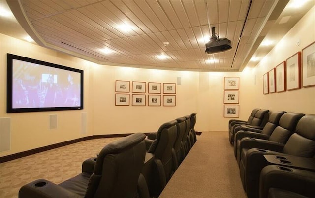 cinema featuring carpet floors and wood ceiling