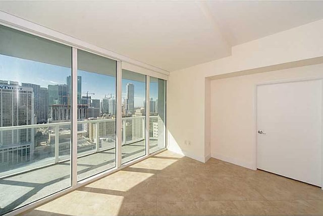 spare room featuring floor to ceiling windows