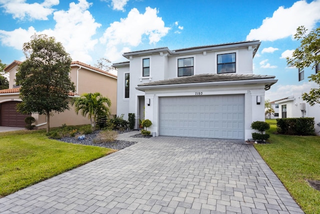 front of property with a front yard and a garage