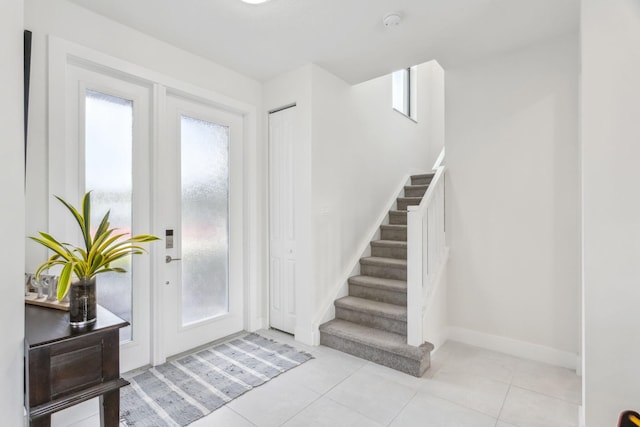 foyer featuring light tile patterned floors