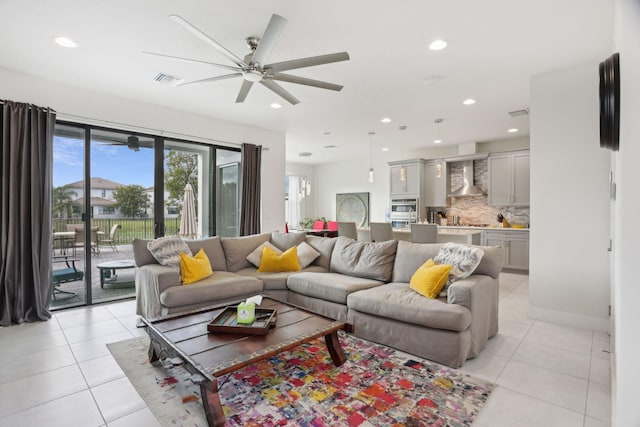 tiled living room with ceiling fan