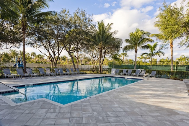 view of swimming pool with a patio area