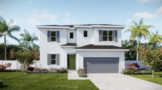 view of front of property featuring a front yard and a garage