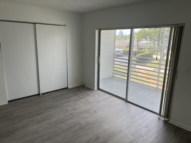 unfurnished bedroom featuring hardwood / wood-style flooring