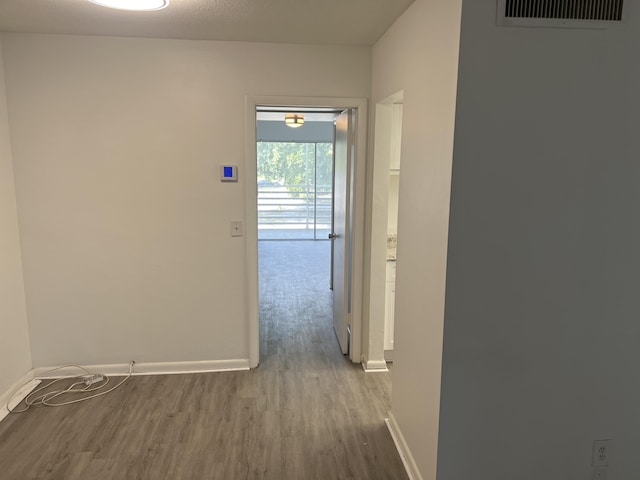 hallway featuring wood-type flooring