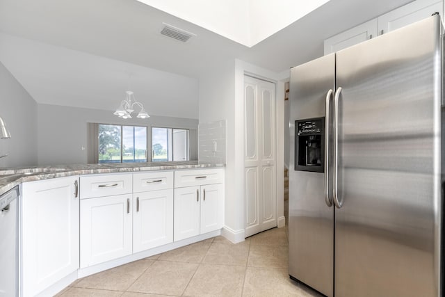 18520 SE Wood Haven Ln Unit I, Jupiter, FL 33469 - kitchen with stainless steel fridge, a sink, a chandelier, white dishwasher, and white cabinets