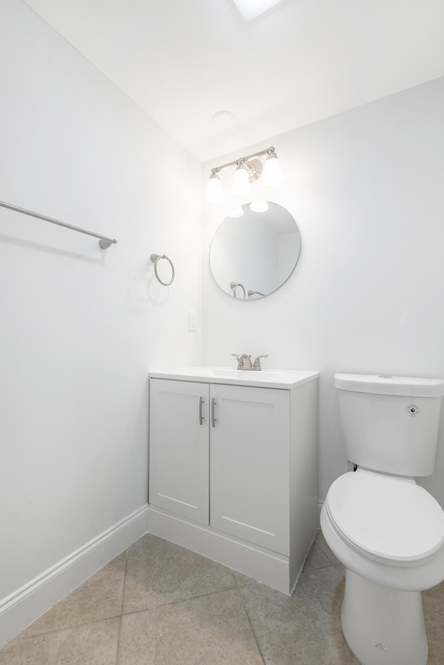 18520 SE Wood Haven Ln Unit I, Jupiter, FL 33469 - bathroom featuring vanity, baseboards, toilet, and tile patterned floors